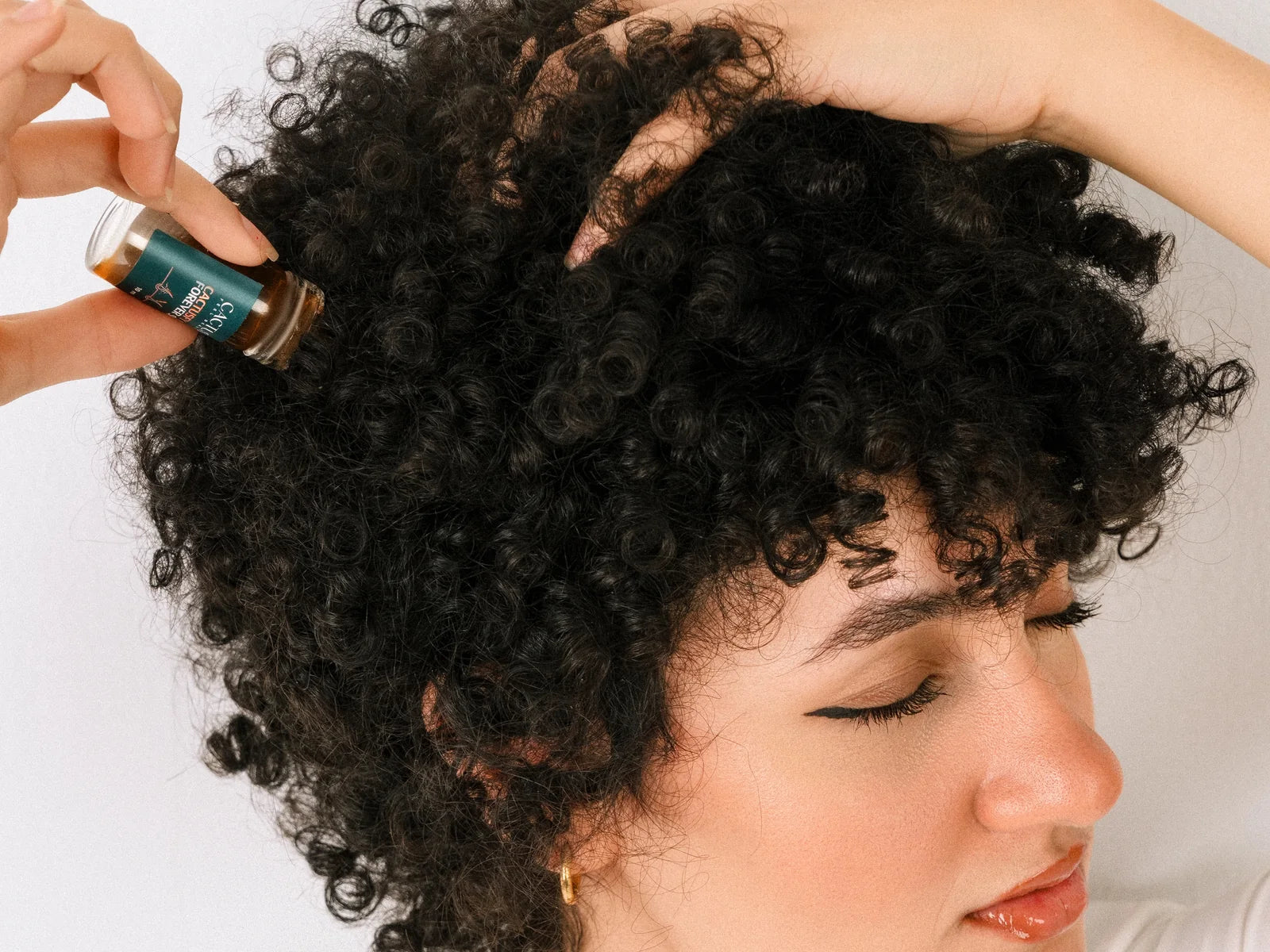 Precision application of Cactusfy Glow Forever Serum to the scalp